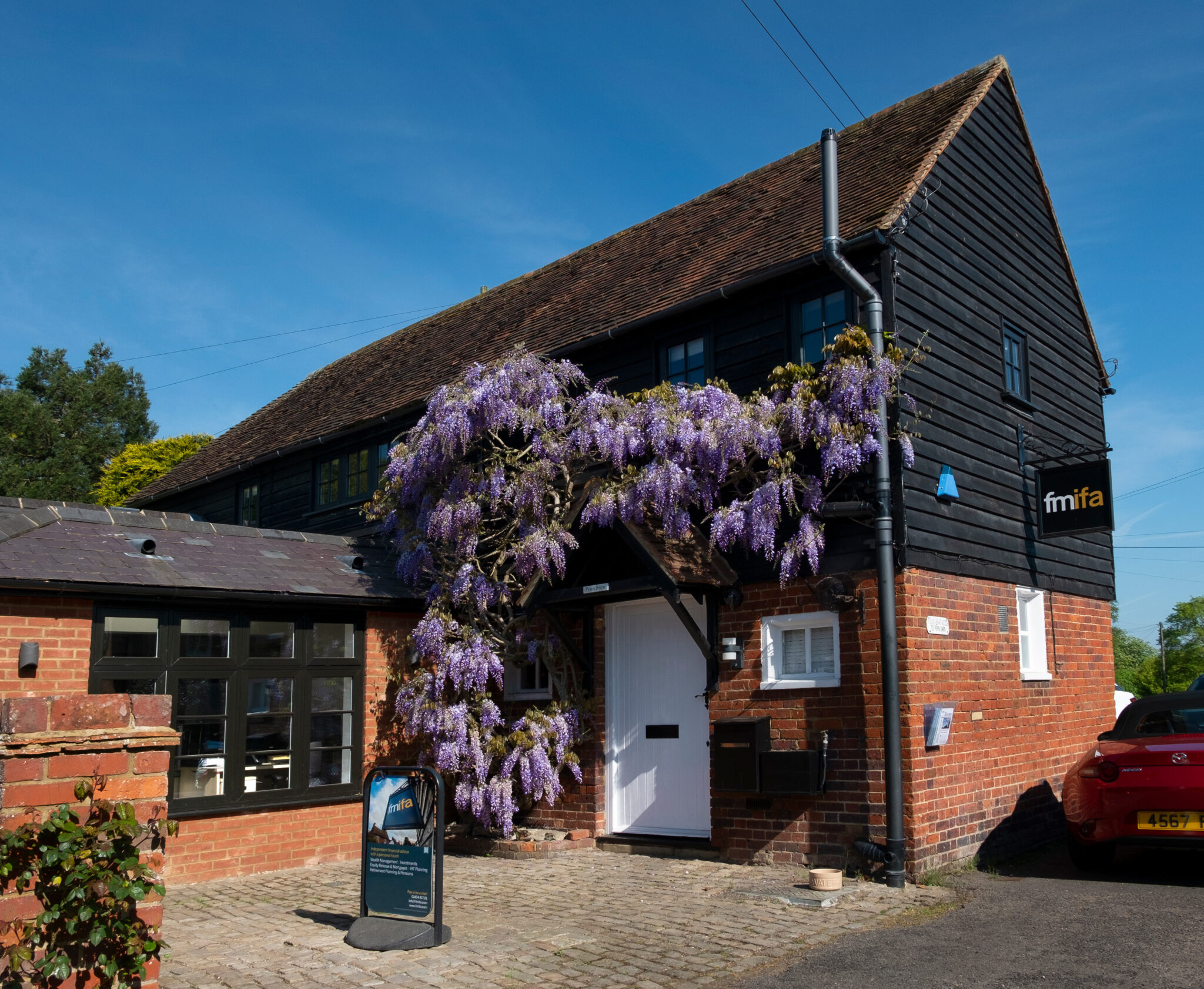 contact-barn-with-wisteria